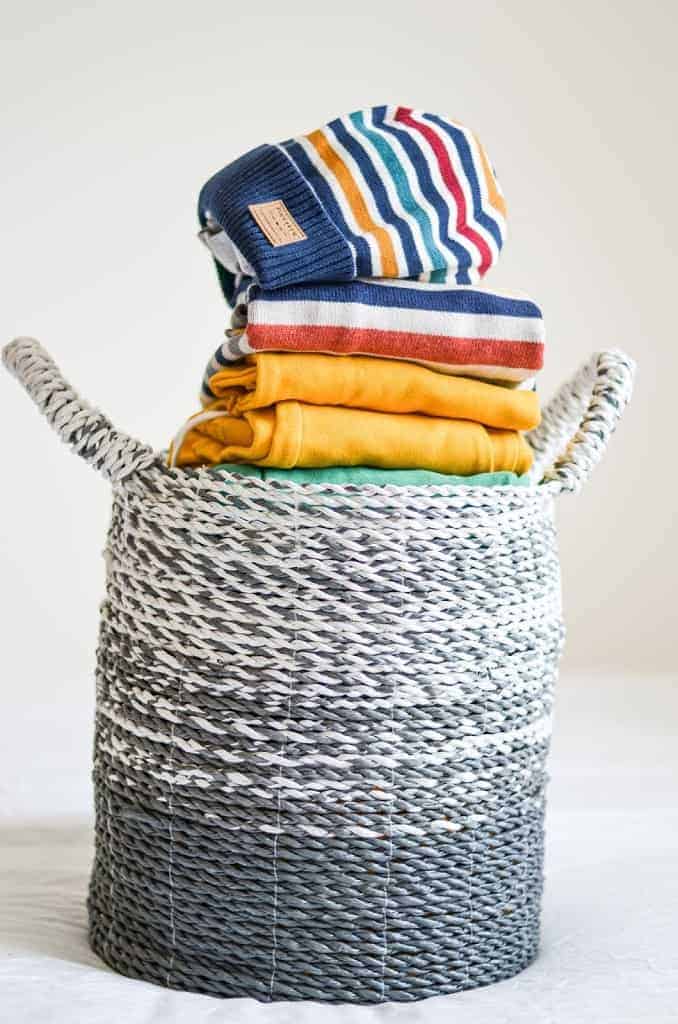 basket with colourful toddler clothes