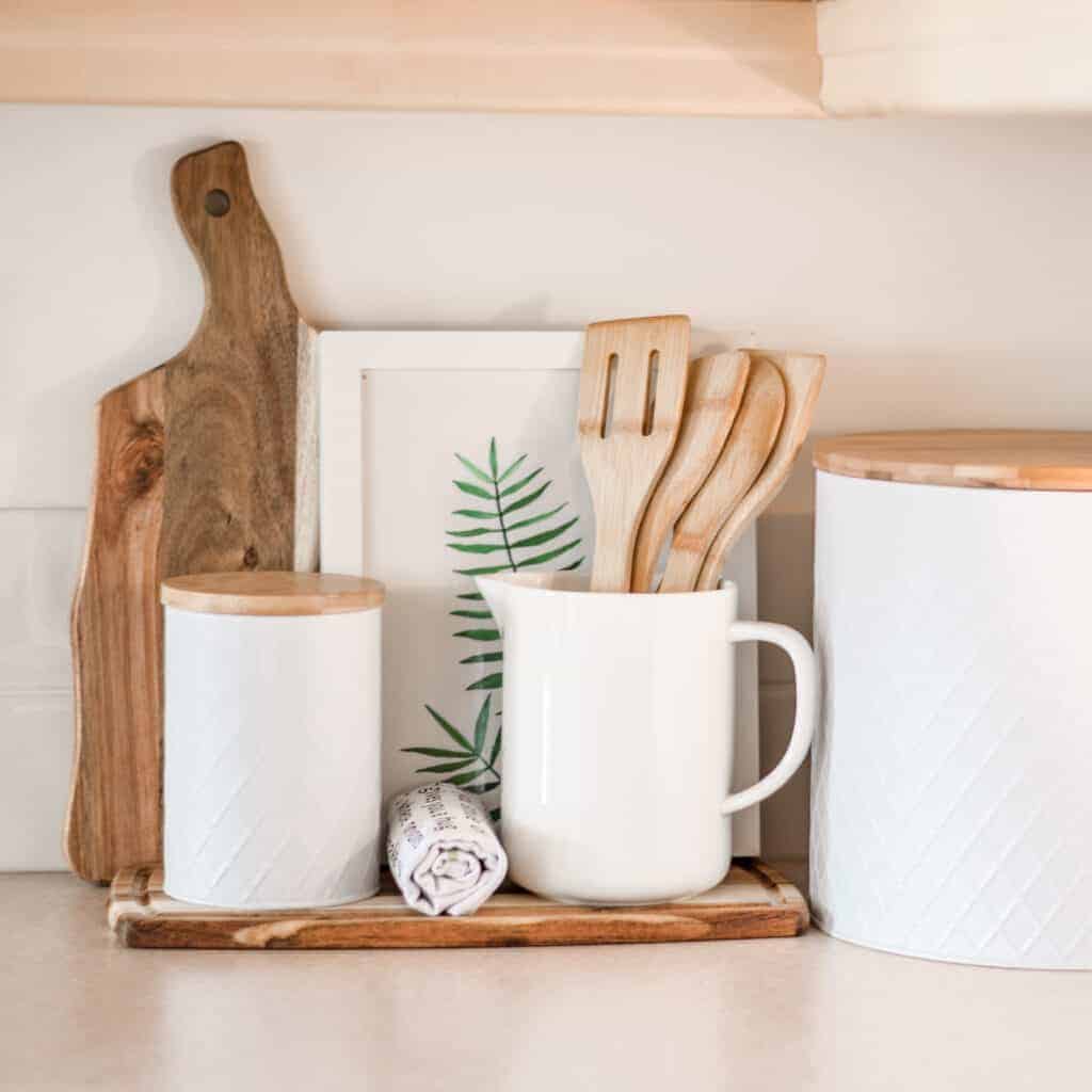 kitchen worktop decor with spatulas, cutting boards and canisters