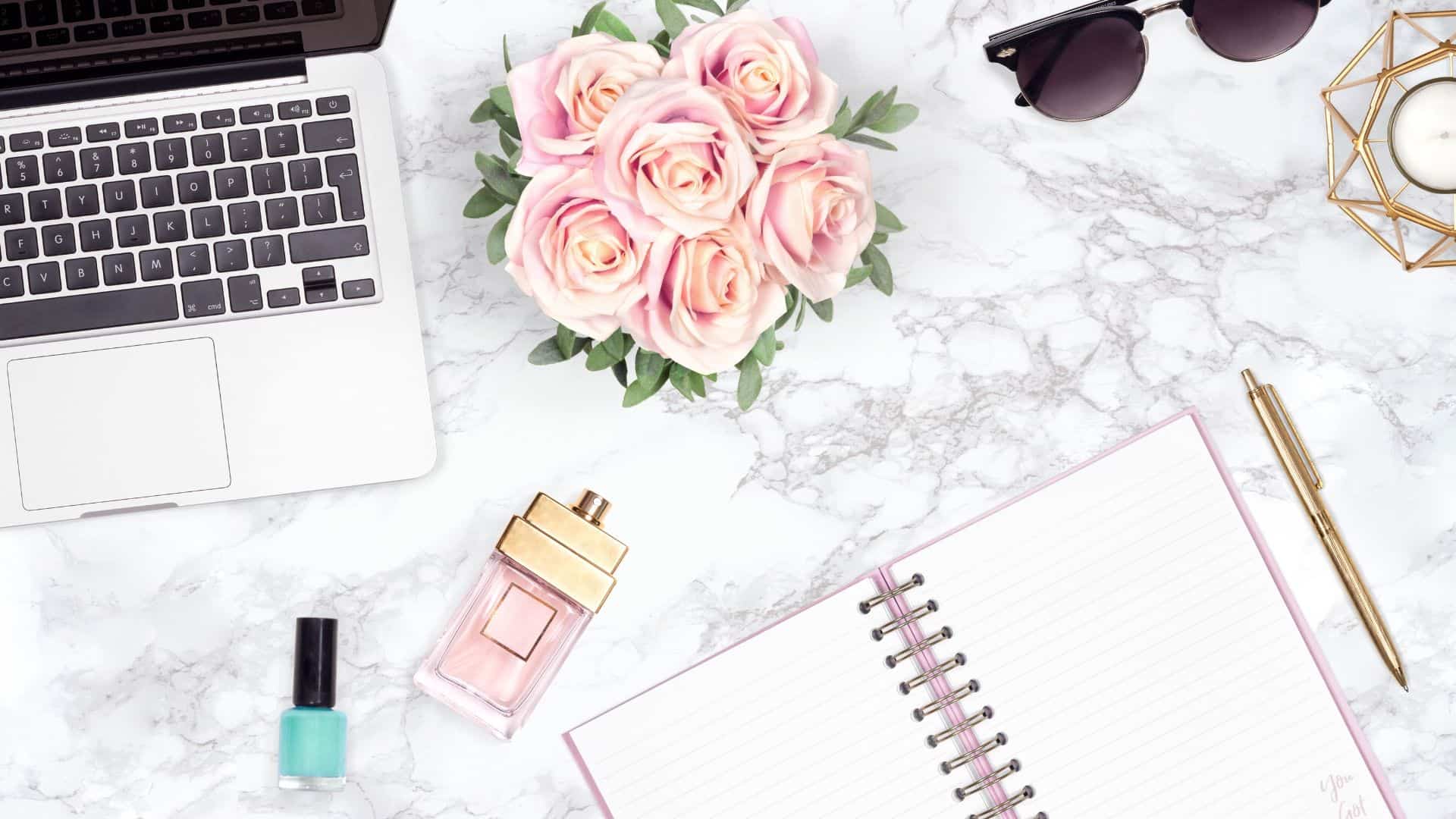 pink girly flatlay example with roses and marble background
